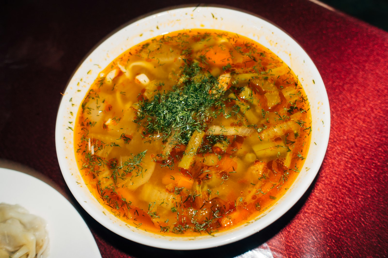 Hearty cabbage and vegetable stew in a white bowl