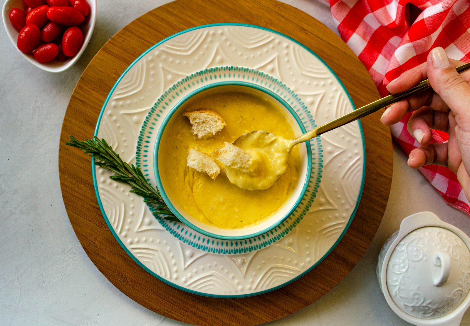Golden lemon chicken broth in a bowl with a spoon