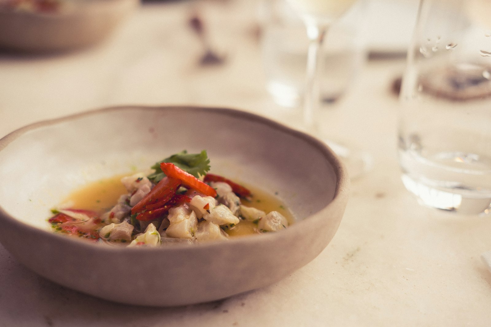 Tuscan white beans and vegetables in a rustic bowl