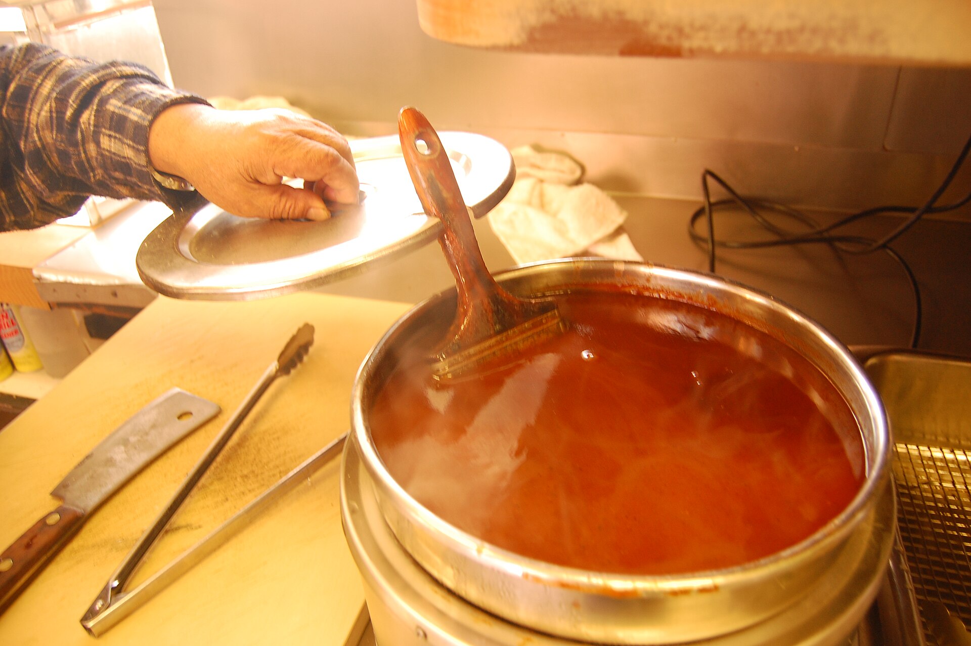 Homemade barbecue sauce warming in a pot