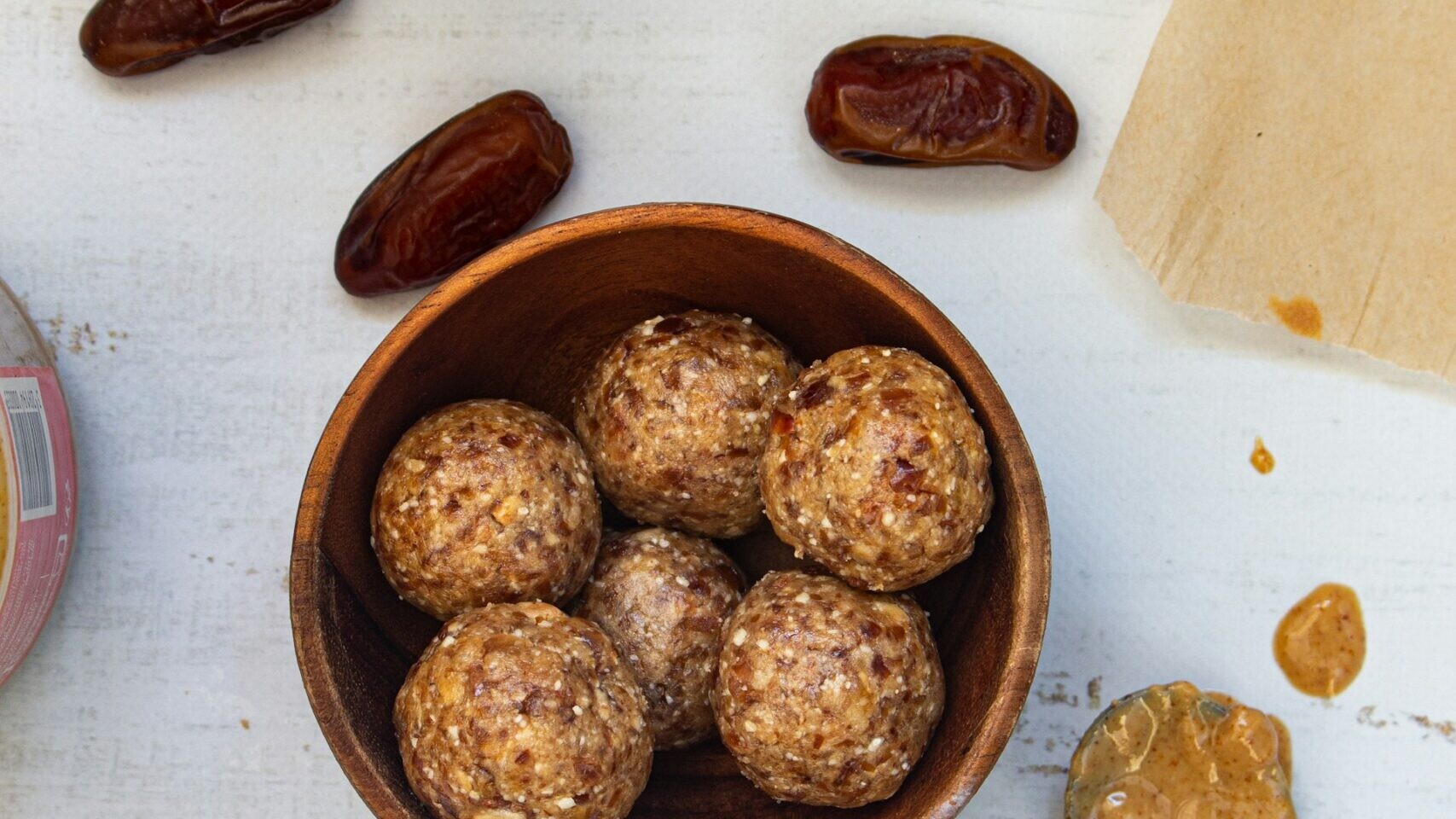 Energy balls made with oats in a wooden bowl