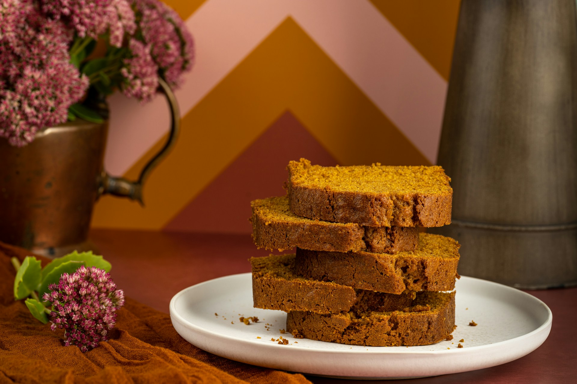 Stack of pumpkin bread slices on a plate