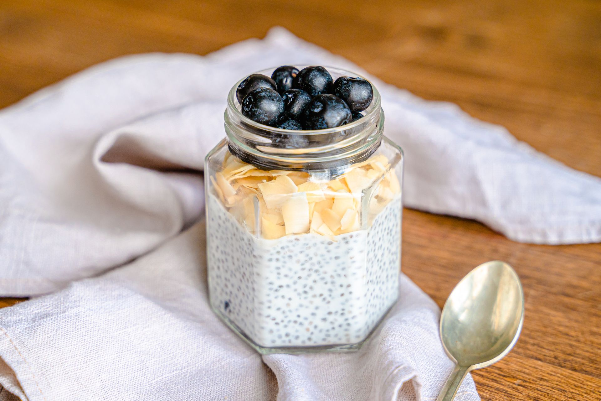 Chia pudding in a jar topped with blueberries