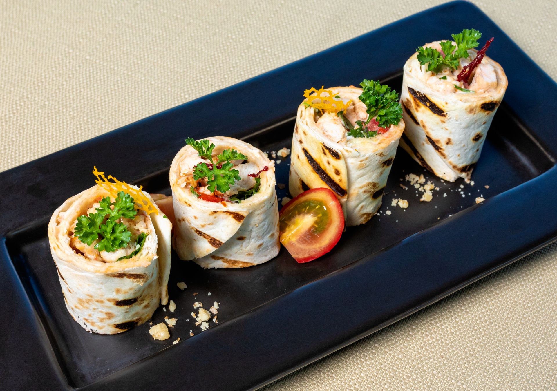 Christmas pinwheels: chicken tortilla roll-ups on a dark slate board
