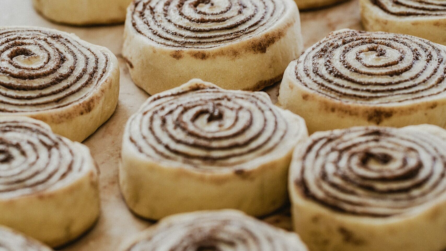 Christmas pinwheels: cinnamon sugar pastry spirals on a baking sheet