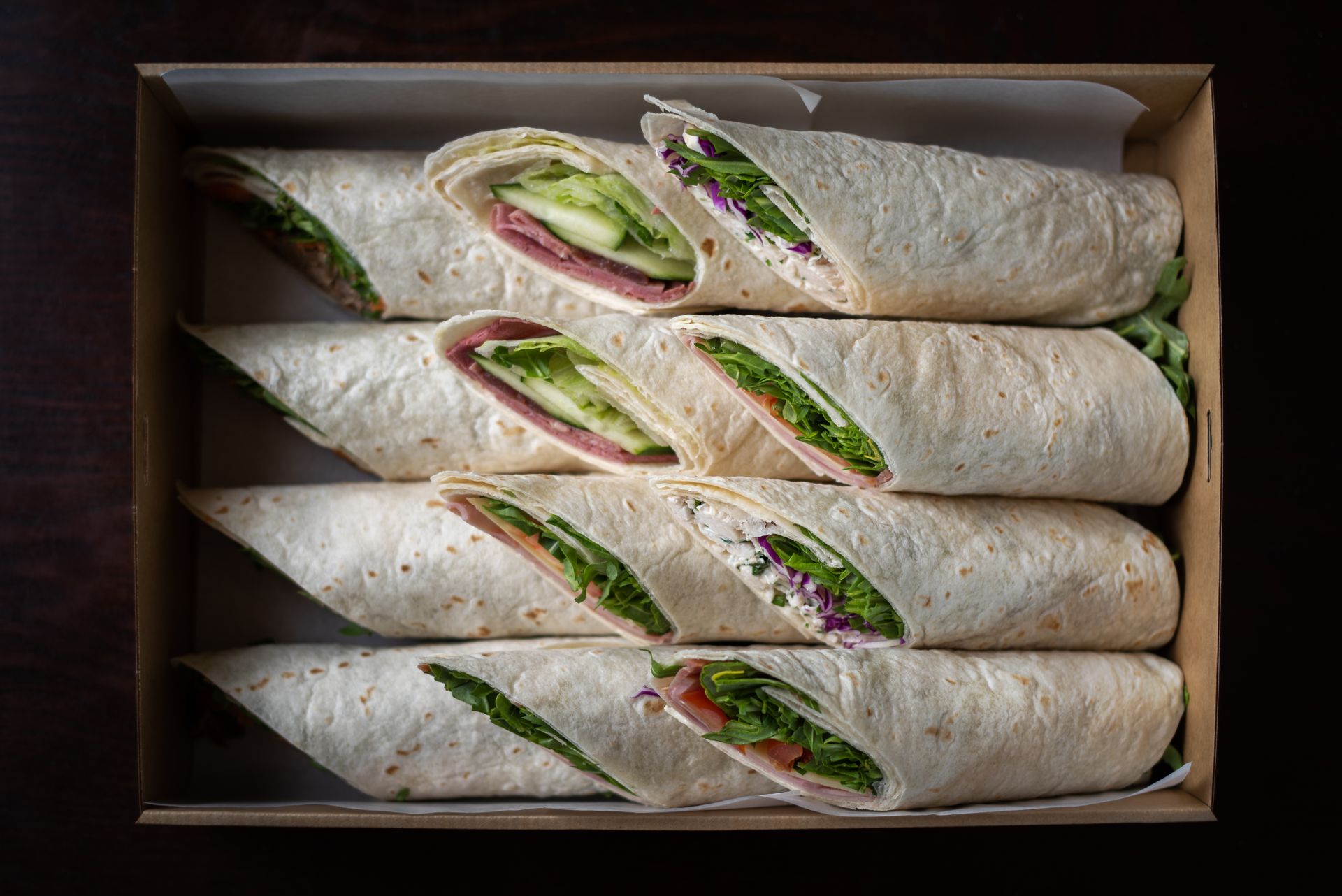 Ham and cheese tortilla wraps rolled and cut in a tray