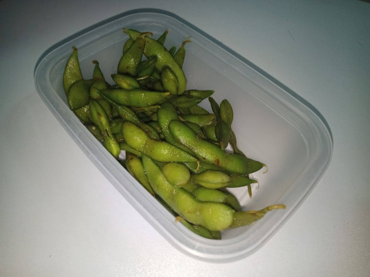 Steamed green edamame soybeans in a tray