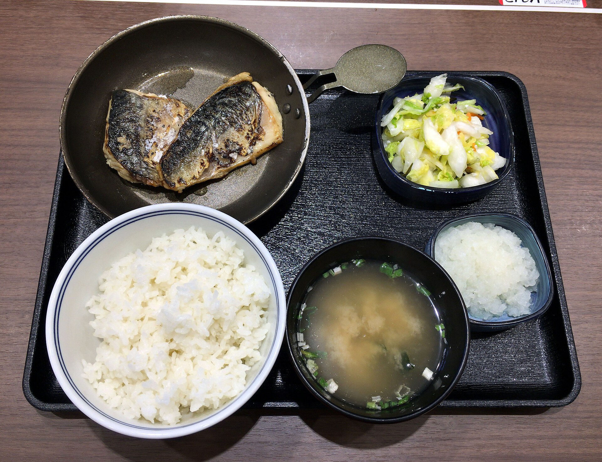 Japanese diet set meal of grilled mackerel, rice, miso soup and pickles