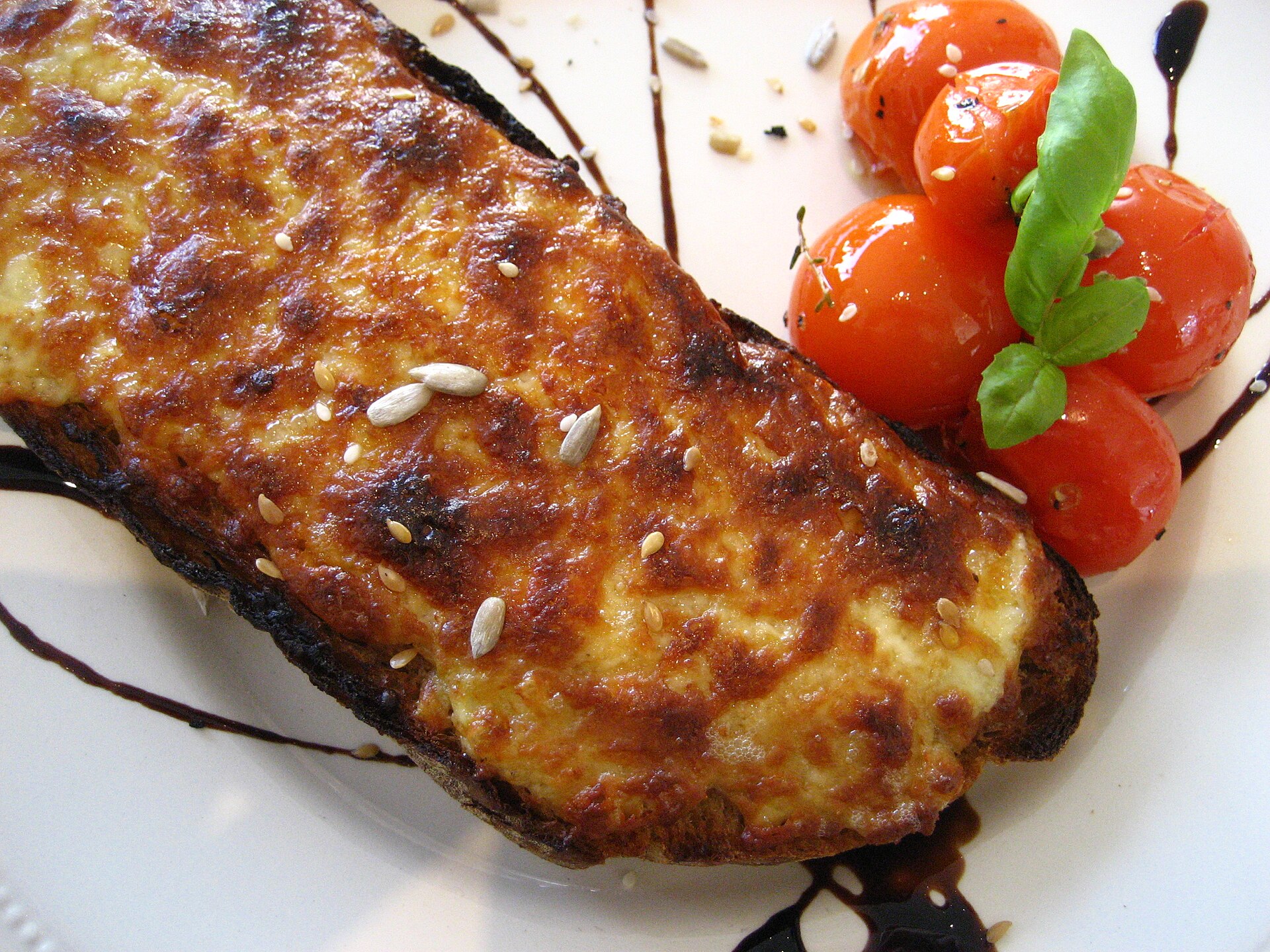 Welsh rarebit cheese toast on a plate with salad