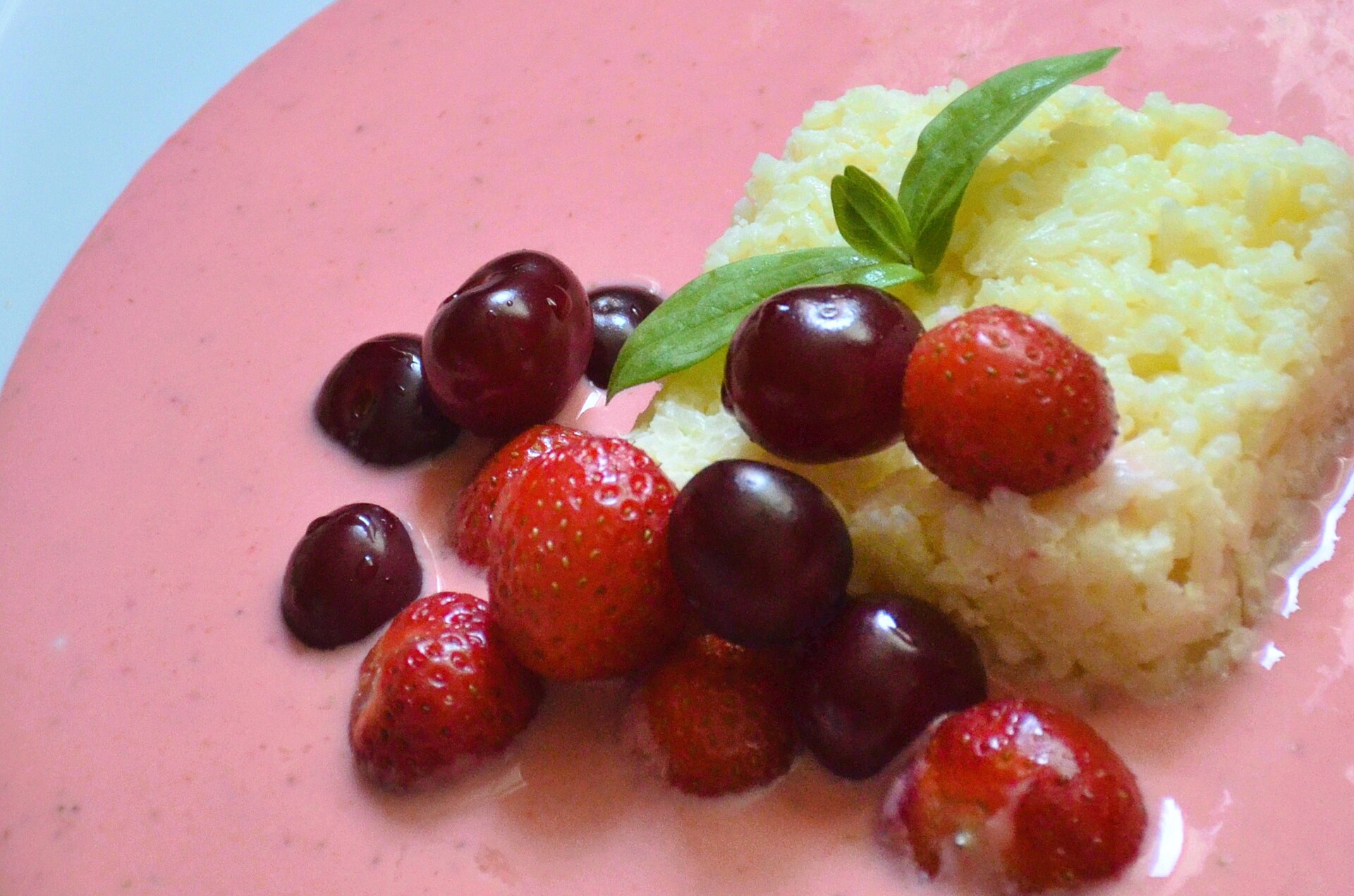 Grandparents' foods: creamy rice pudding with cherries and strawberries