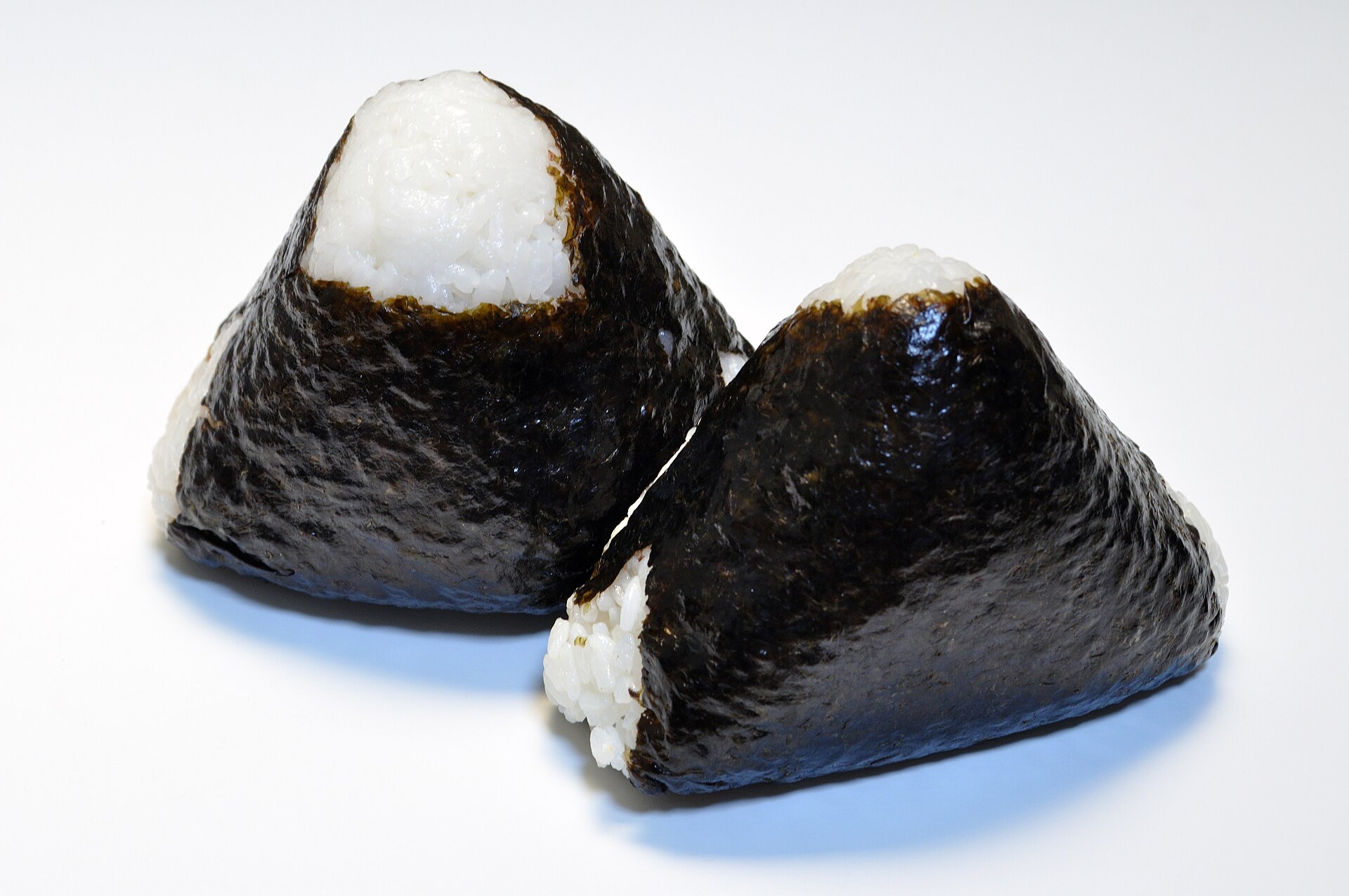 Two onigiri rice balls wrapped in seaweed