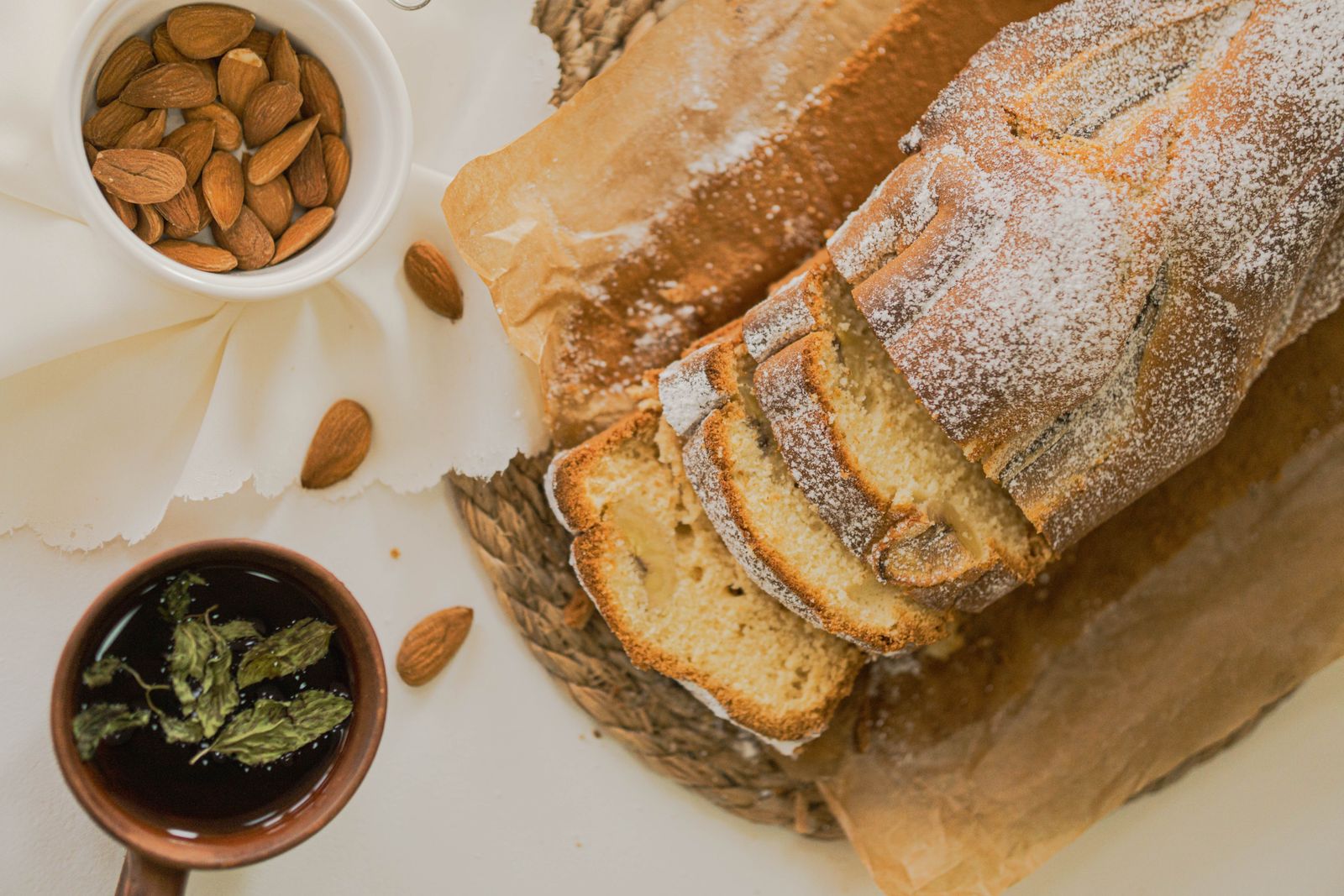 Sliced almond flour keto bread loaf with whole almonds