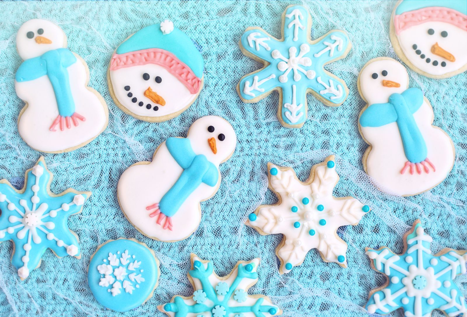 Iced snowman and snowflake cut-out cookies