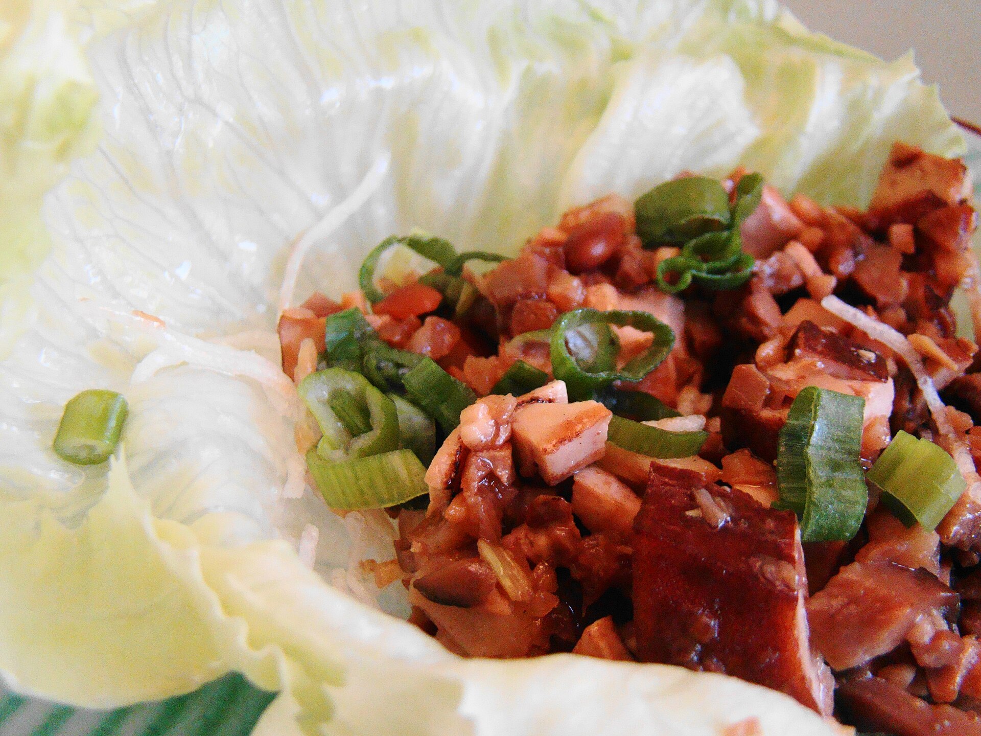 Lettuce cups filled with savory pork and green onion