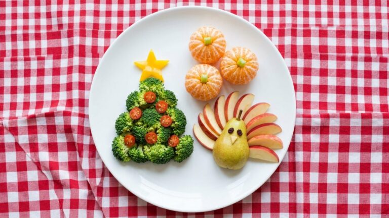 Fun food for kids: broccoli Christmas tree with tomato ornaments, apple turkey and clementine pumpkins