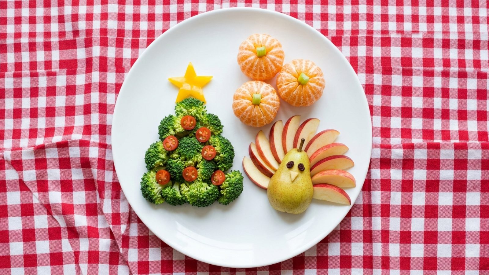 Fun food for kids: broccoli Christmas tree with tomato ornaments, apple turkey and clementine pumpkins
