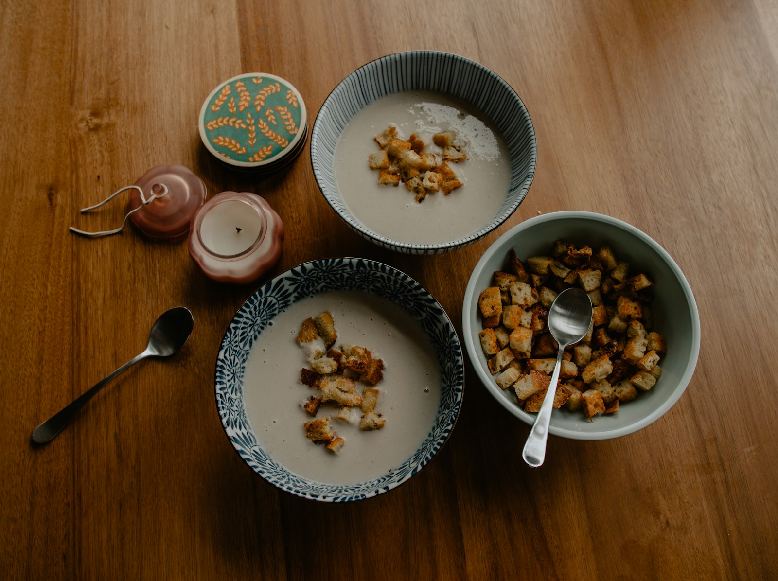 Bowls of creamy white bean soup with croutons