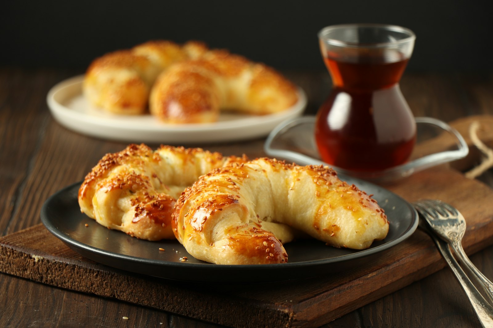 Golden rolled crescent pastries on a plate