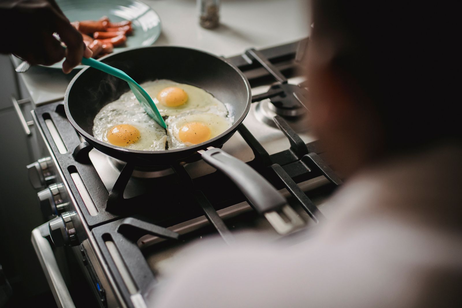 Eggs cooking in a pan on the stove