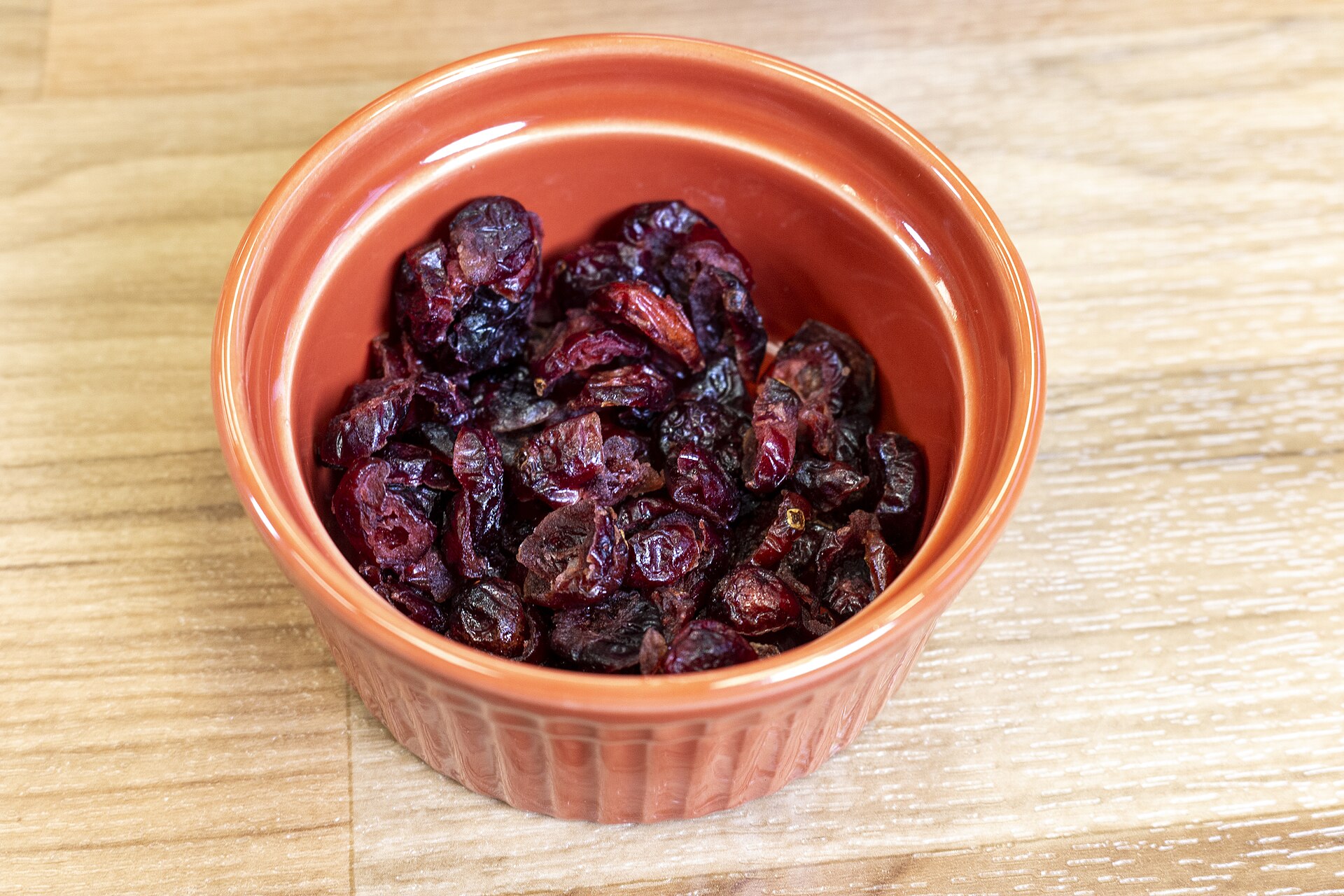 A small bowl of dried cranberries, part of the minimally processed meal in the study