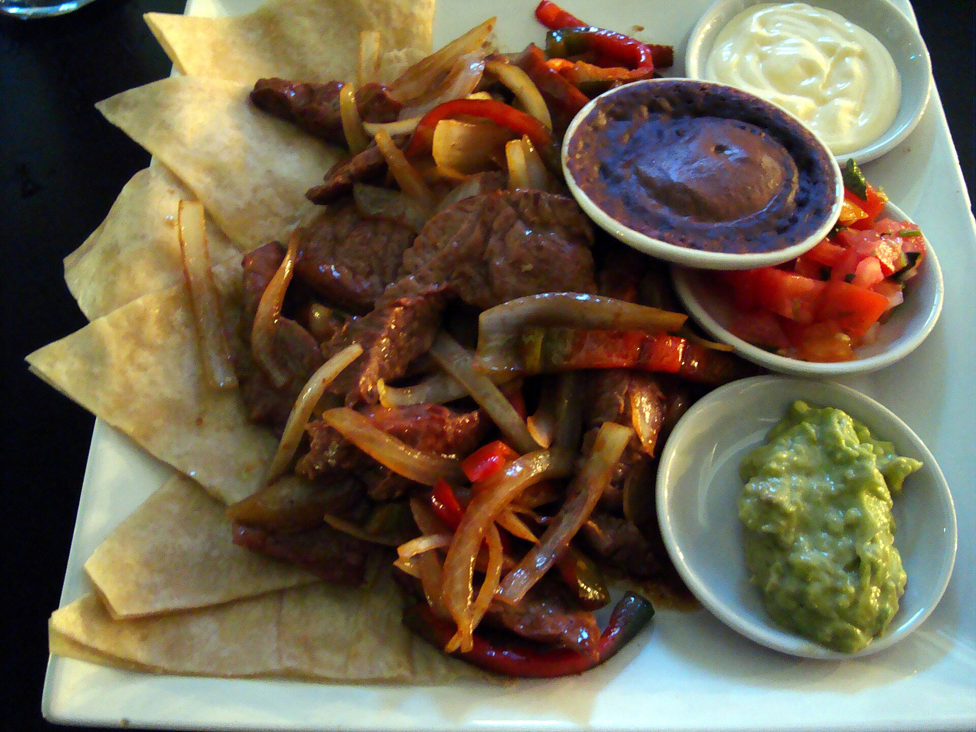 Sizzling fajitas with peppers and onions