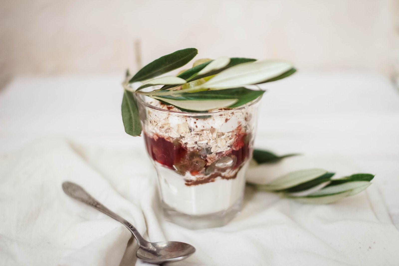 Berry and Greek yogurt parfait in a tall glass