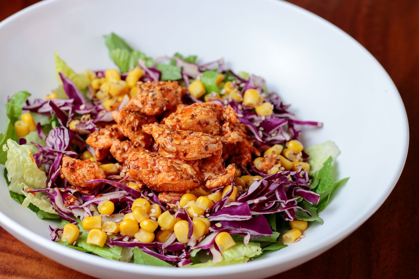 Chopped salad with spiced chicken, corn and red cabbage