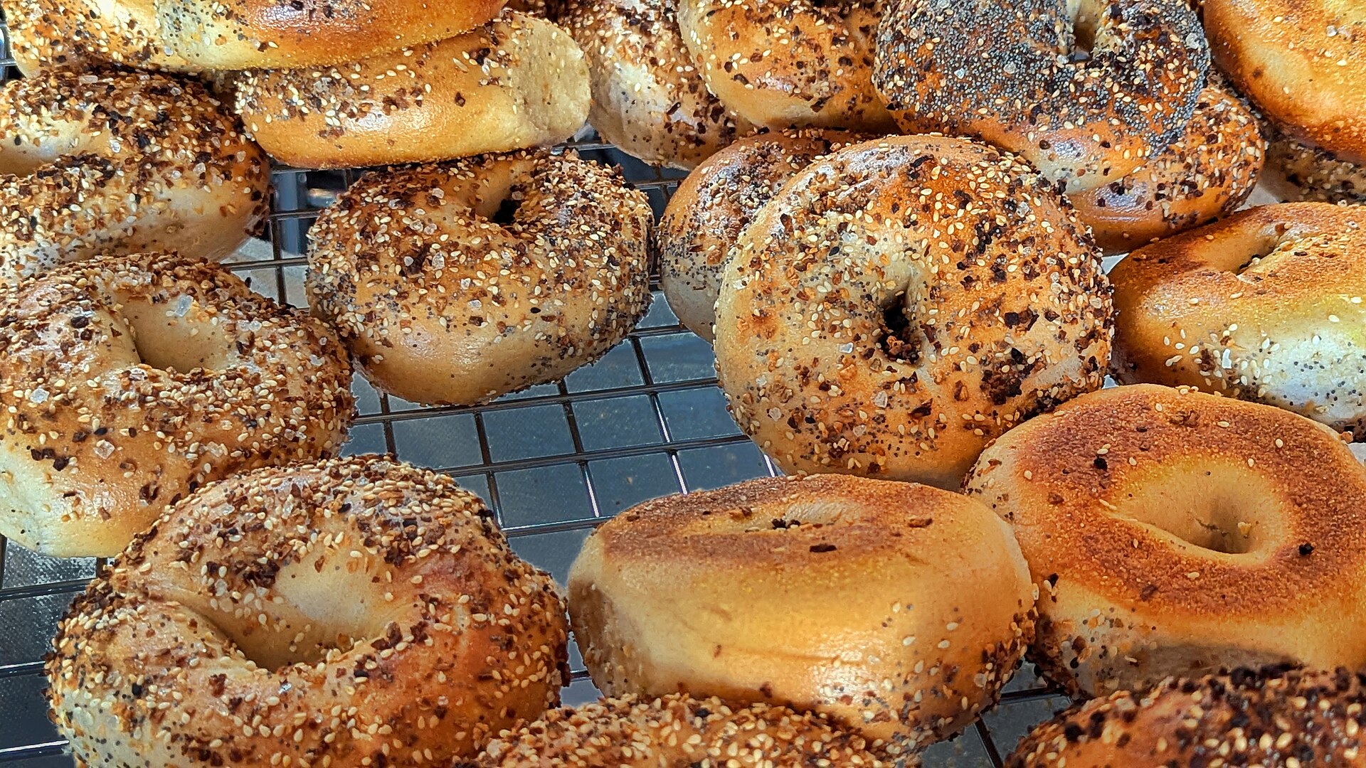 Everything bagels piled in a basket