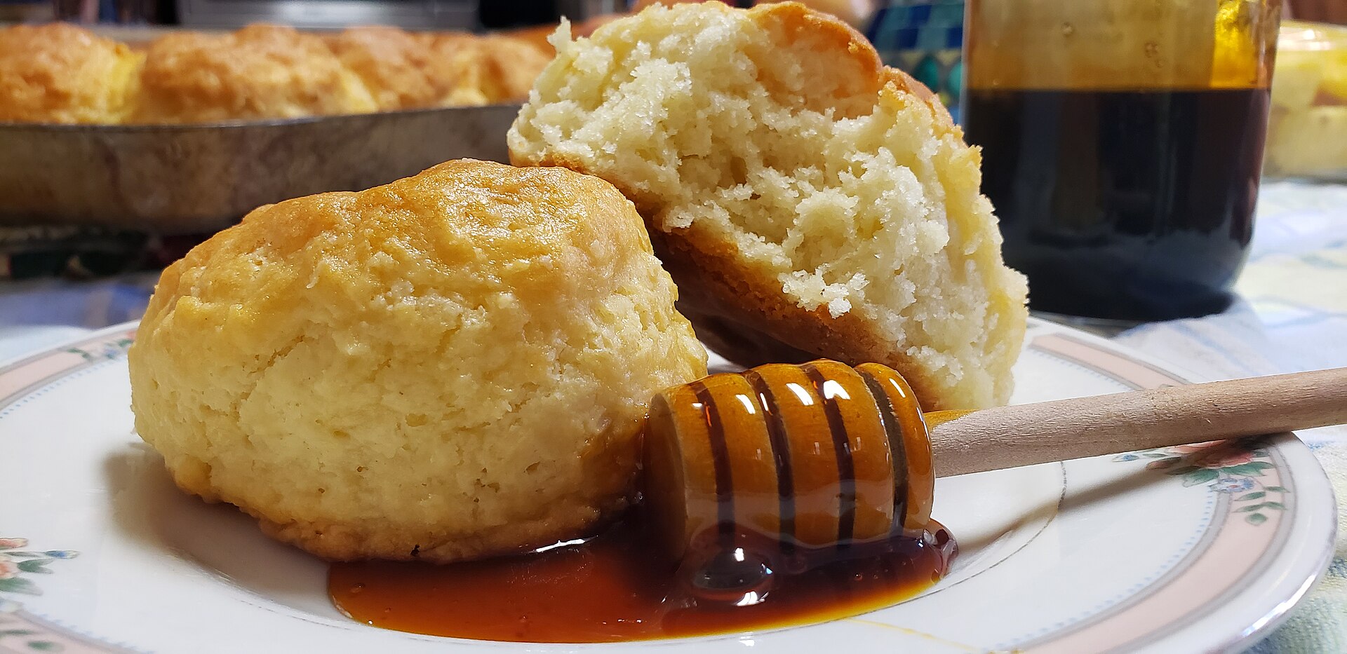 A homemade biscuit with a drizzle of sorghum