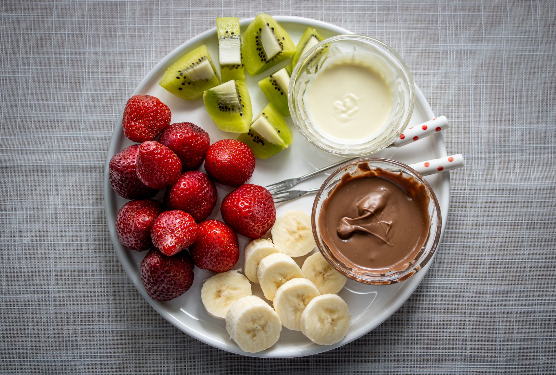 Fresh fruit platter with a creamy dip in the center