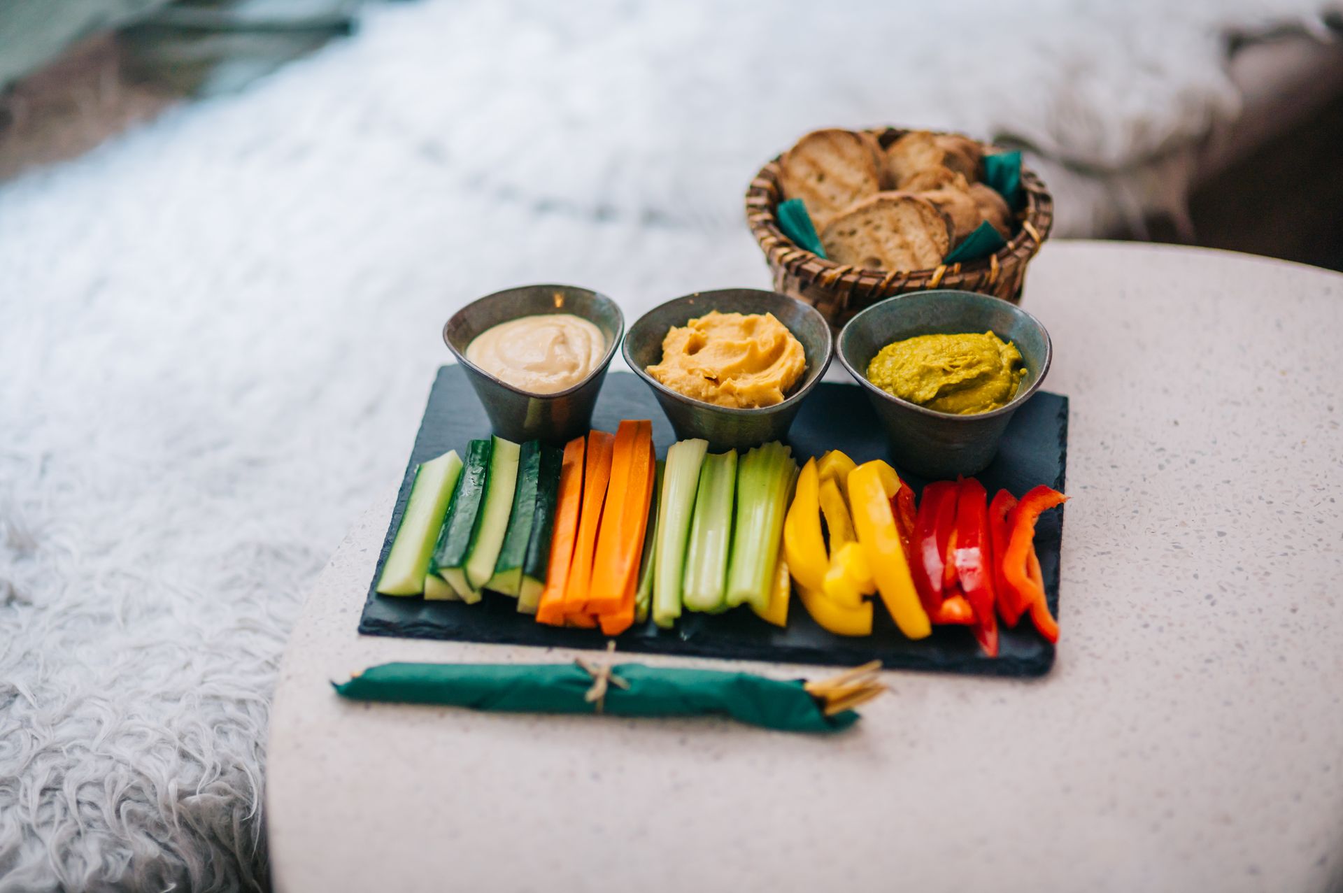 Vegetable sticks with creamy dips on a platter