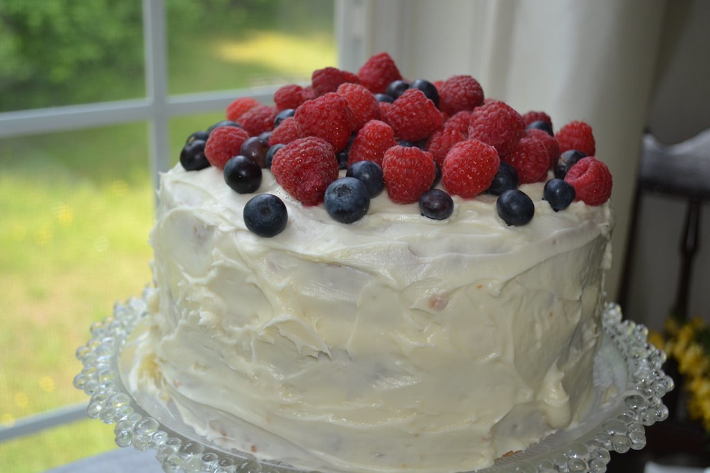 Layered hummingbird cake with cream cheese frosting and pecans