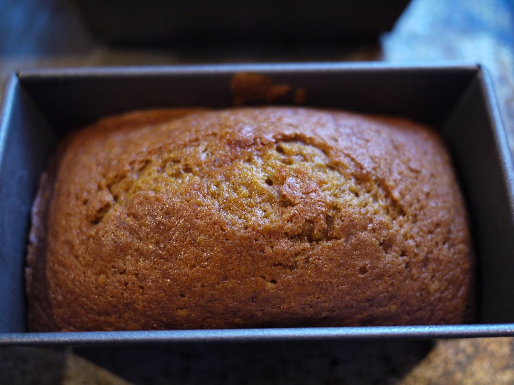 Loaf of pumpkin bread with a golden crackly top