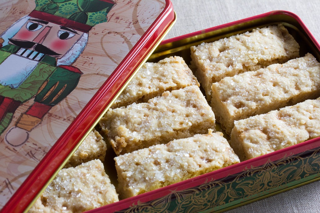Buttery shortbread squares in a tin