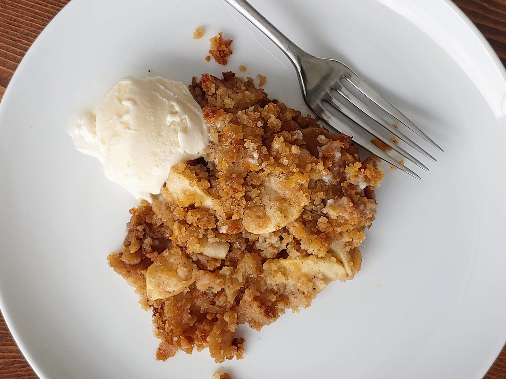 Brown betty served warm with a scoop of vanilla ice cream