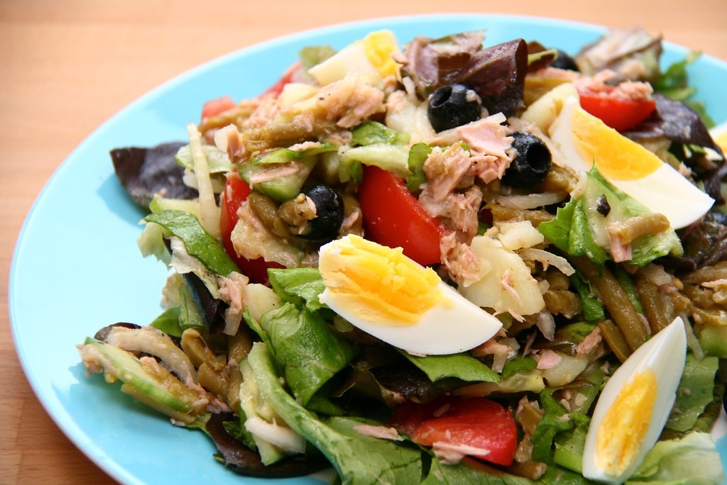 Salade nicoise with tuna, boiled eggs, tomatoes, beans and olives