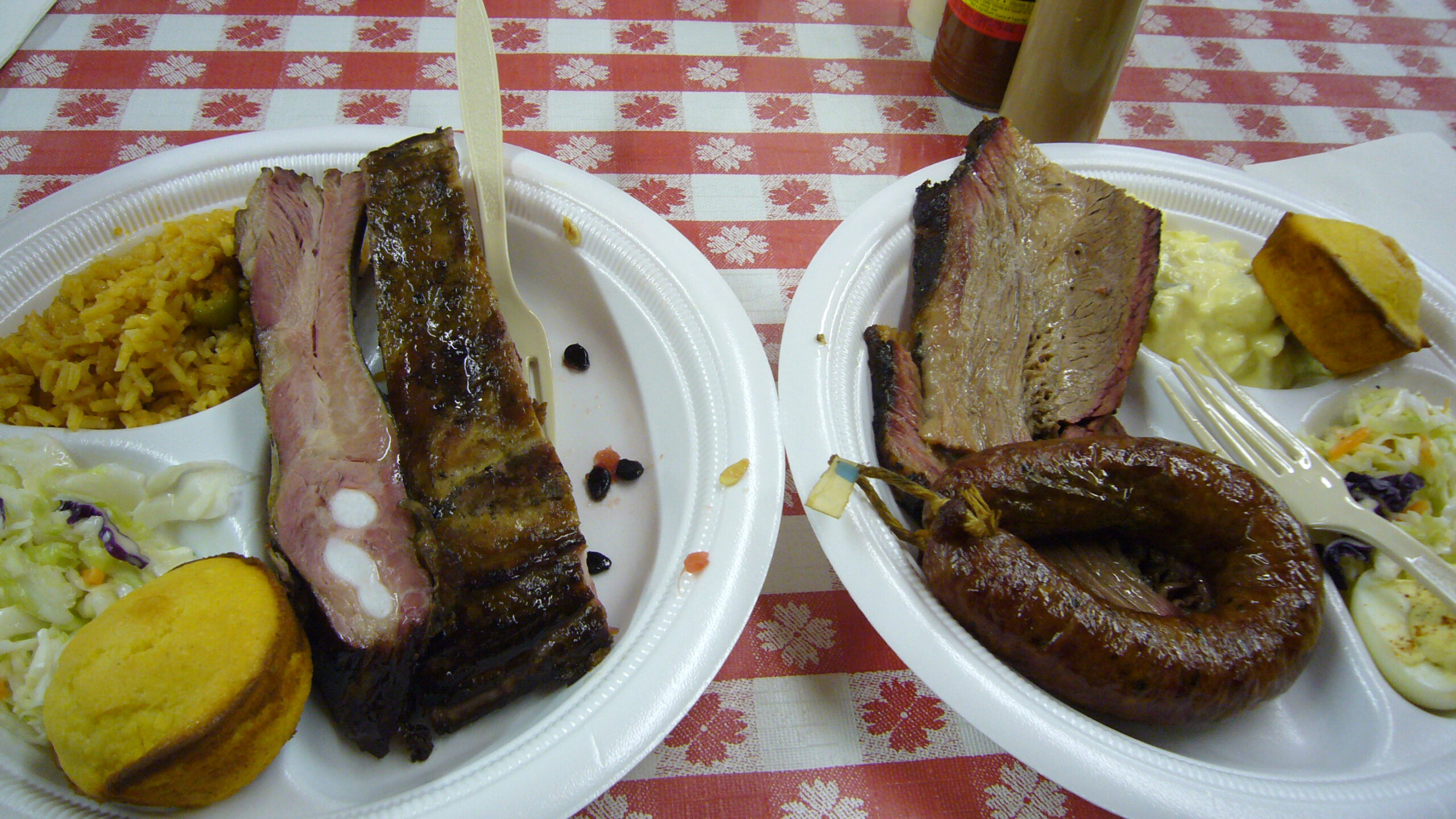 Texas-style oven brisket slices on a plate with sides