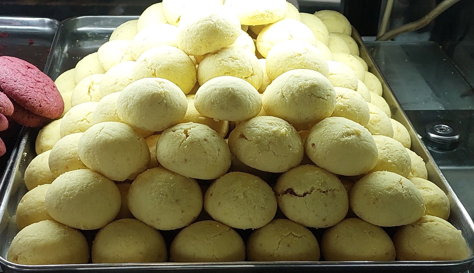 Tray of soft pale chip cookies stacked high