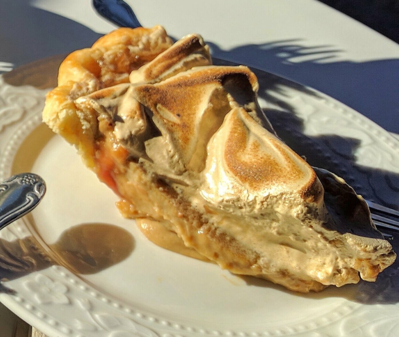 Slice of old-fashioned butterscotch pie with toasted meringue