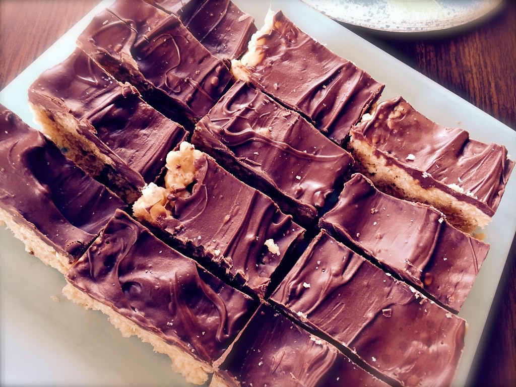Scotcheroos cut into squares with a chocolate topping