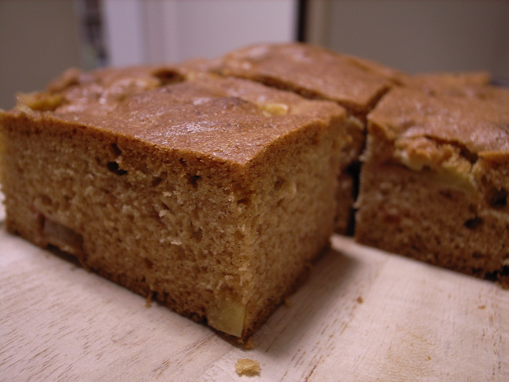 Squares of fresh apple cake on a board