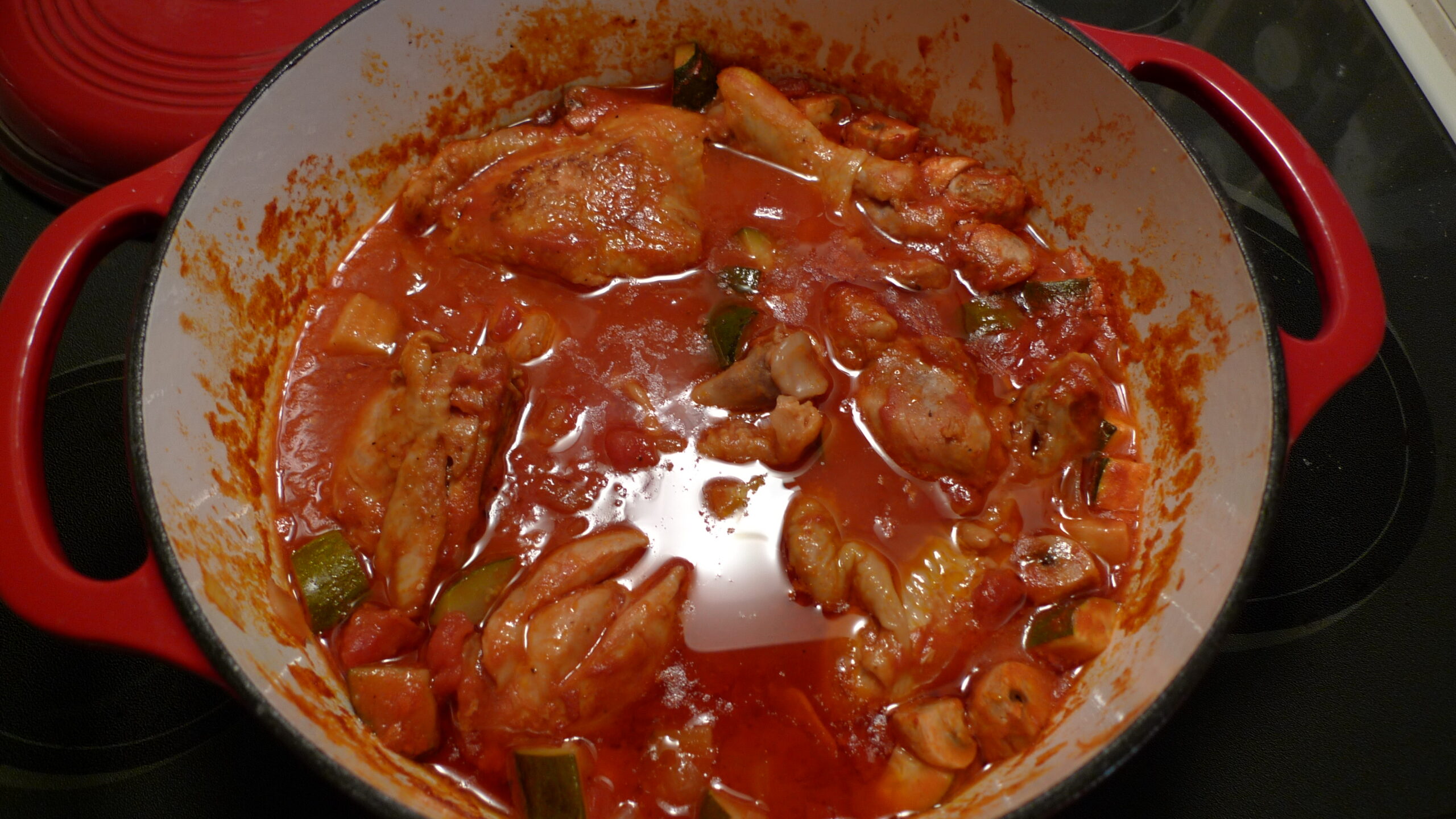 Chicken cacciatore with peppers and mushrooms in tomato sauce