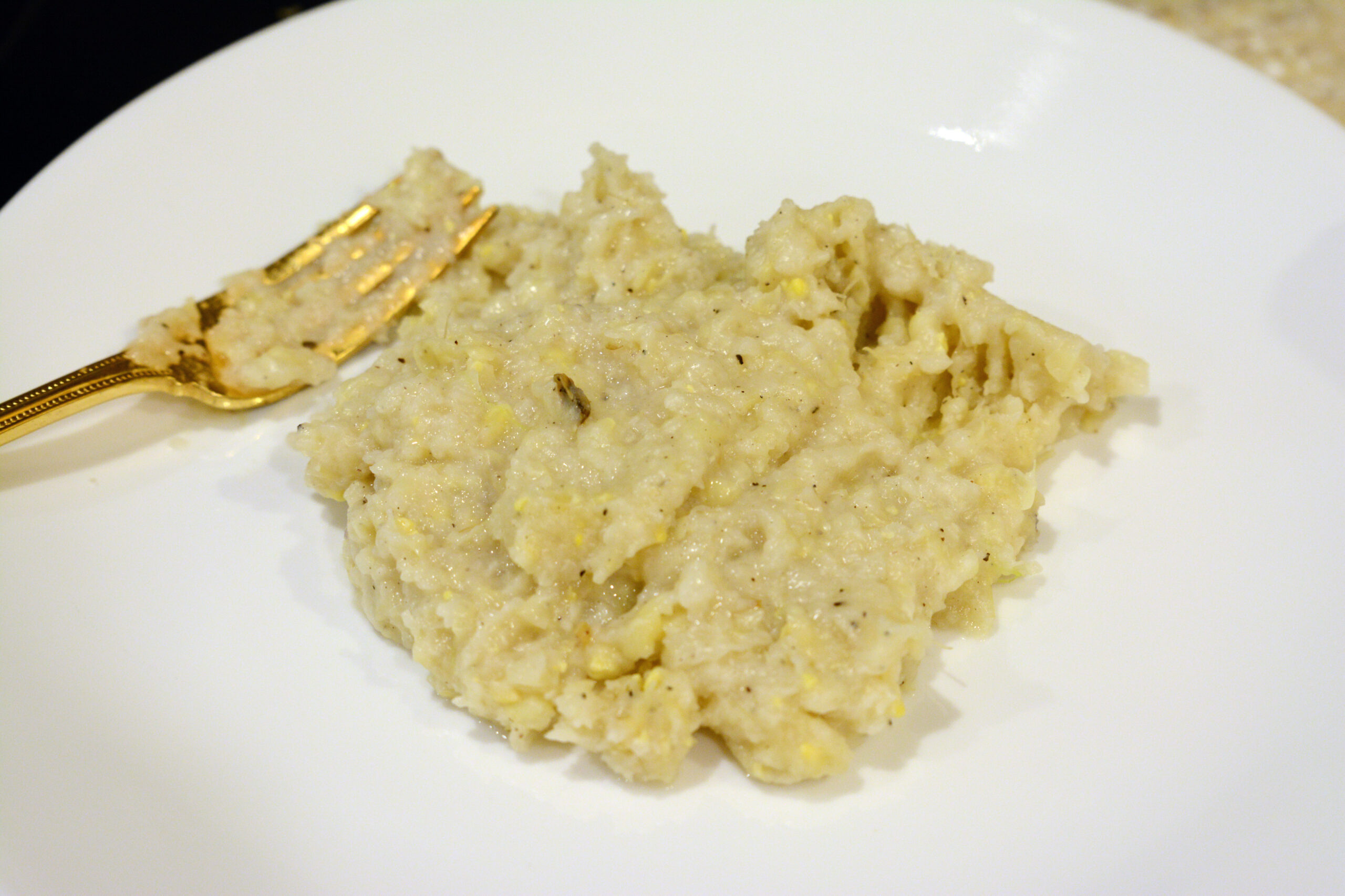 Creamy skillet corn on a white plate