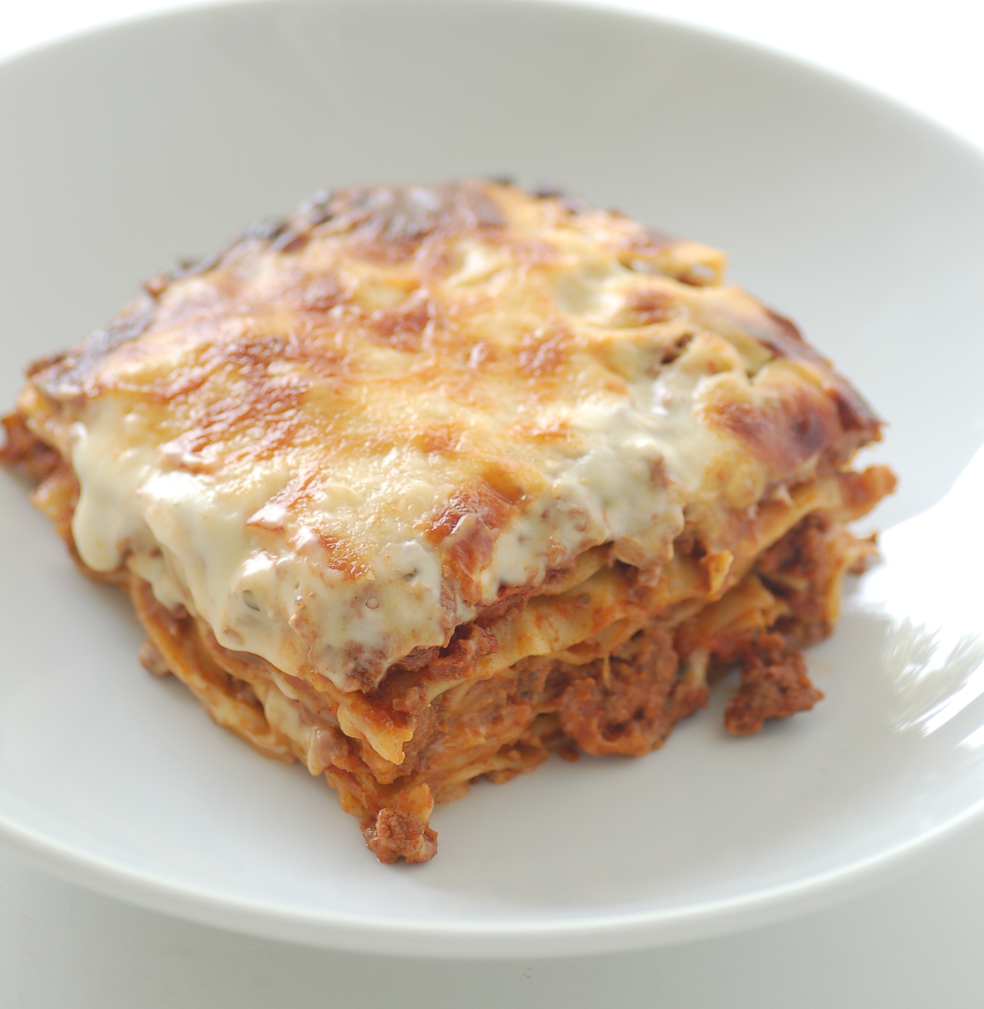 Slice of baked lasagna, a celebrity mom recipe Mark Wahlberg loves