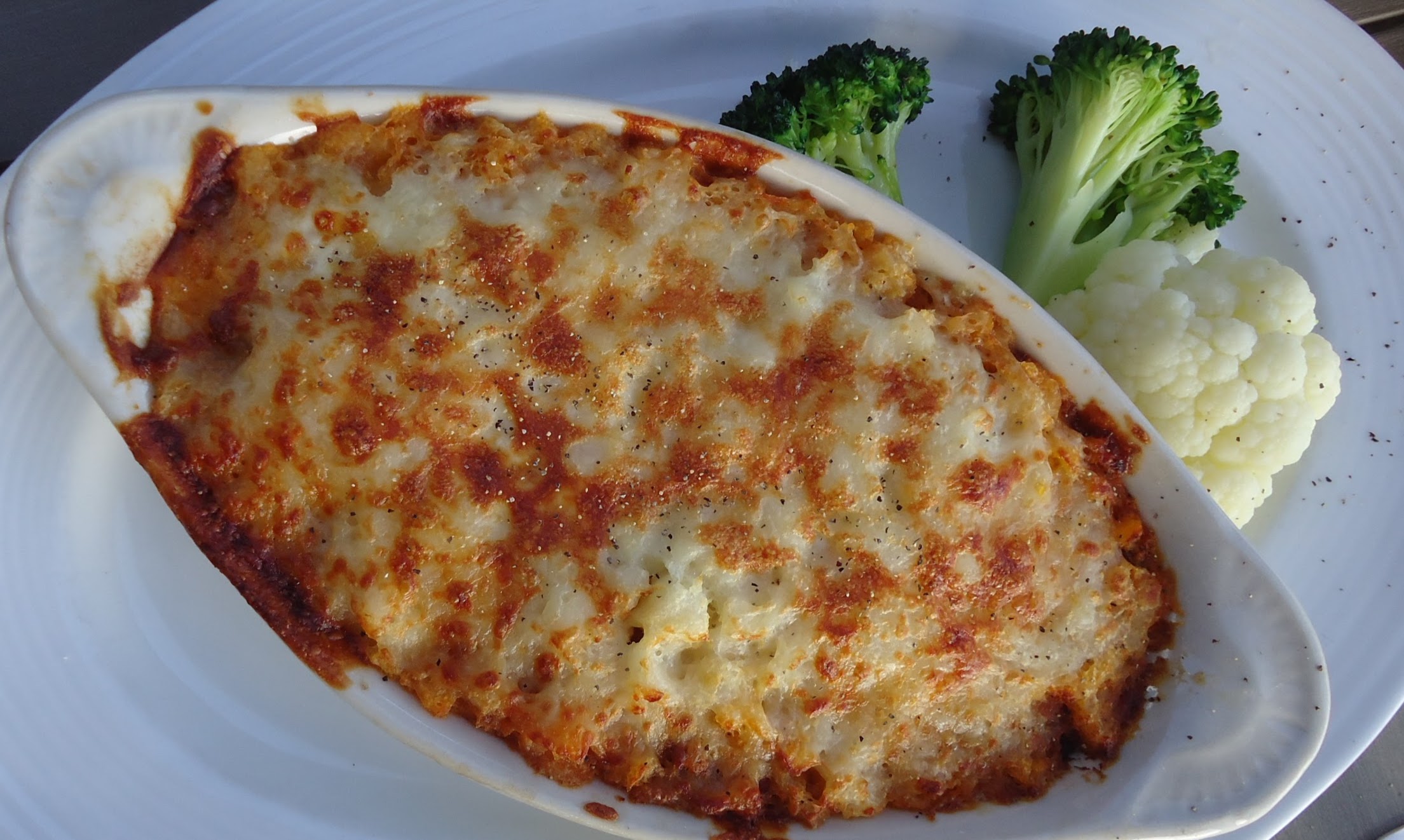 Shepherd's pie with golden mashed potato topping and broccoli