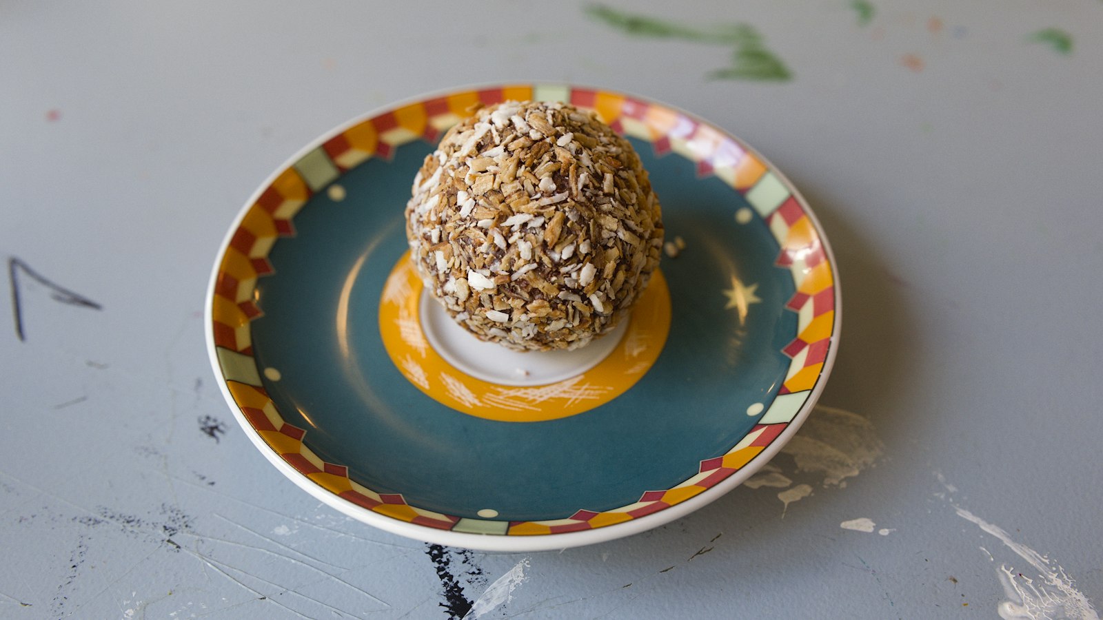 Nut crusted make ahead appetizer on a colorful plate