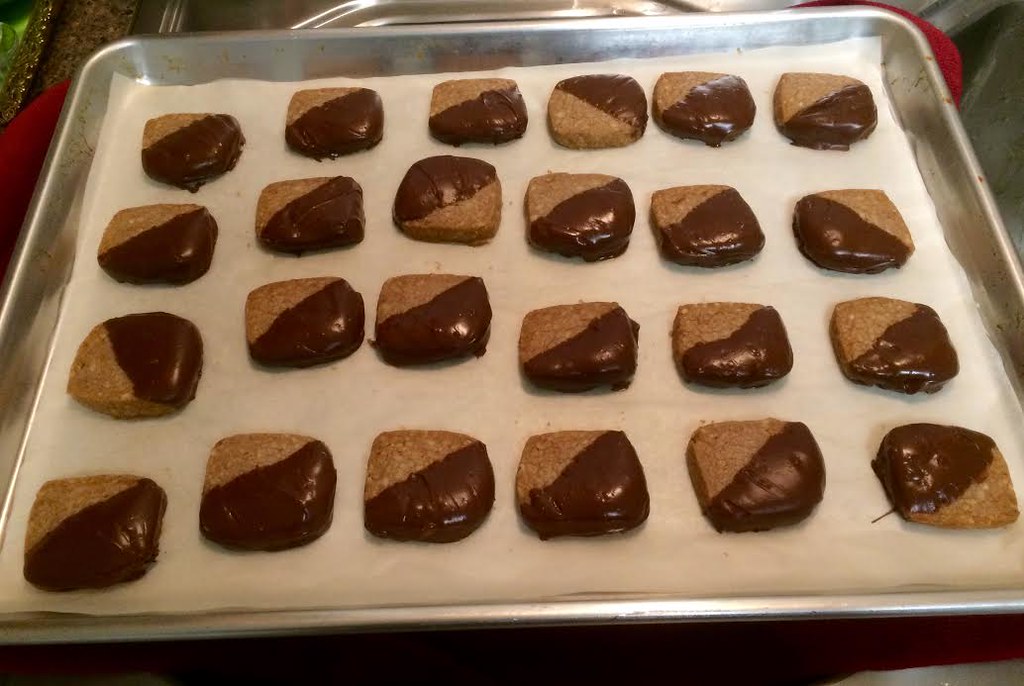 Butter sandies dipped in milk chocolate on a tray