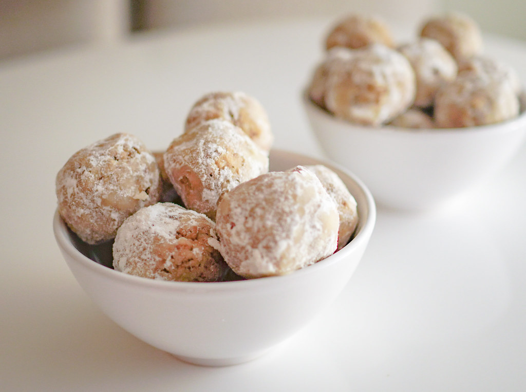 Powdered sugar snowballs piled in white bowls
