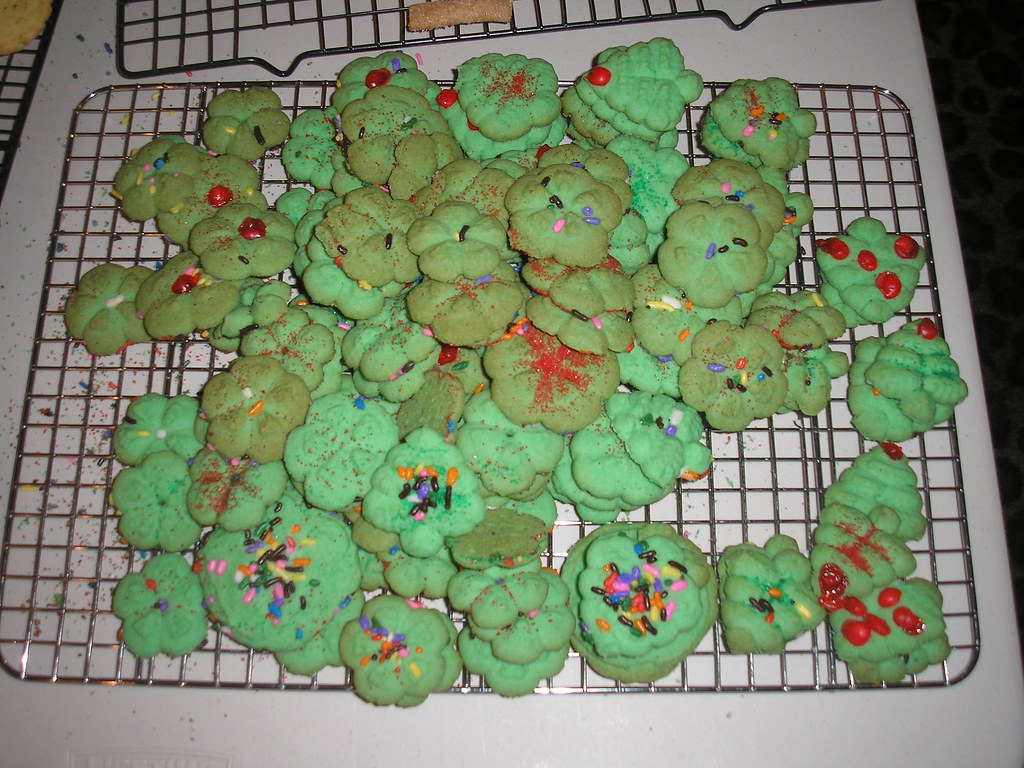 Green wreath spritz cooling on a wire rack