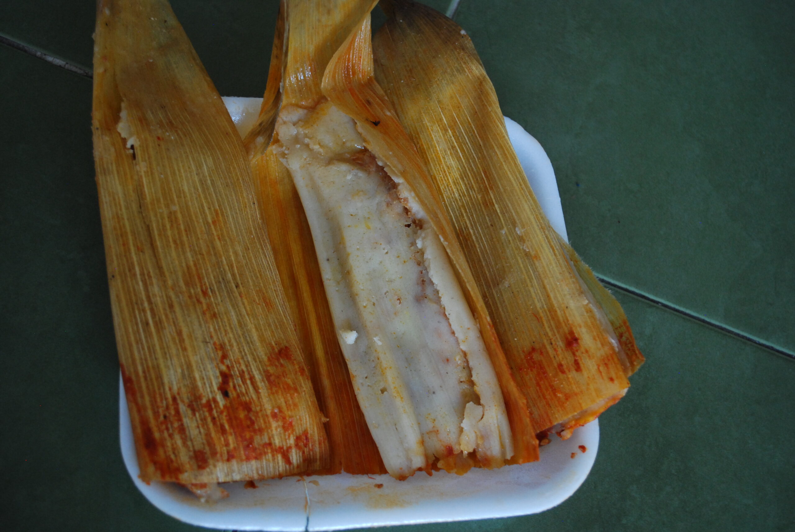 Red chile tamal from Durango unwrapped from its corn husk